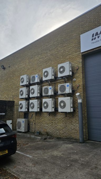 Commercial air conditioning outdoor units installed on a building by Exact Temp